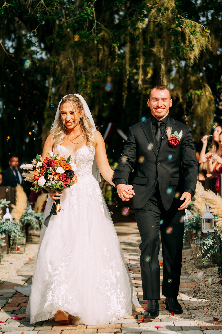 Bride and groom walking back down the aisle after getting married at Ever After Farms Ranch